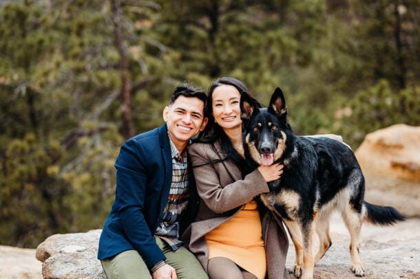 Couple sitting with shephard dog